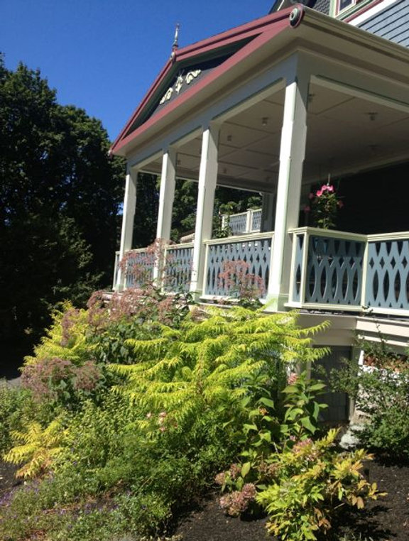 The rebuilt porch above the perennial beds